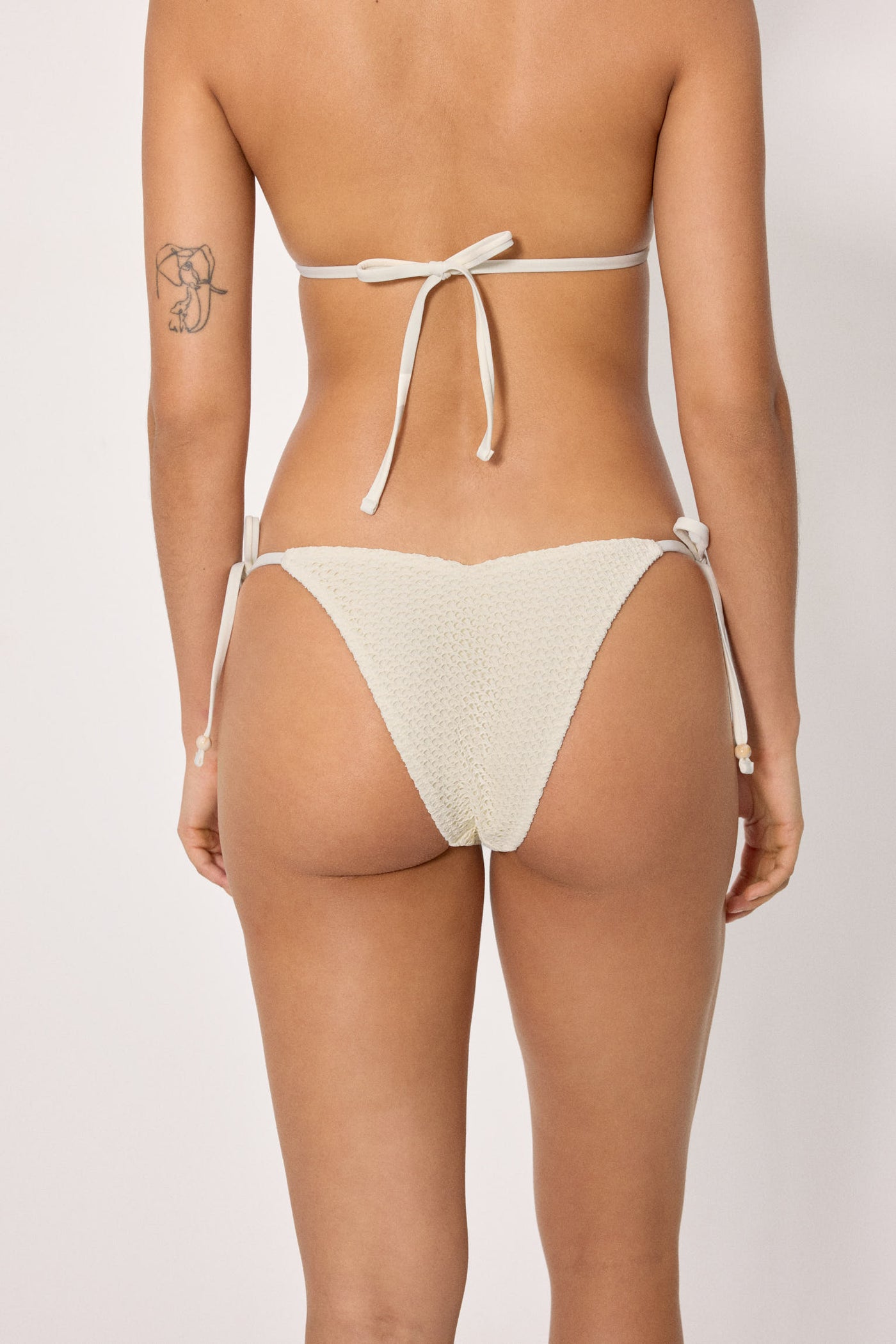 SLIP BIKINI BRASILIANO CON LACCETTI TRAFORATO PANNA YSABEL MORA