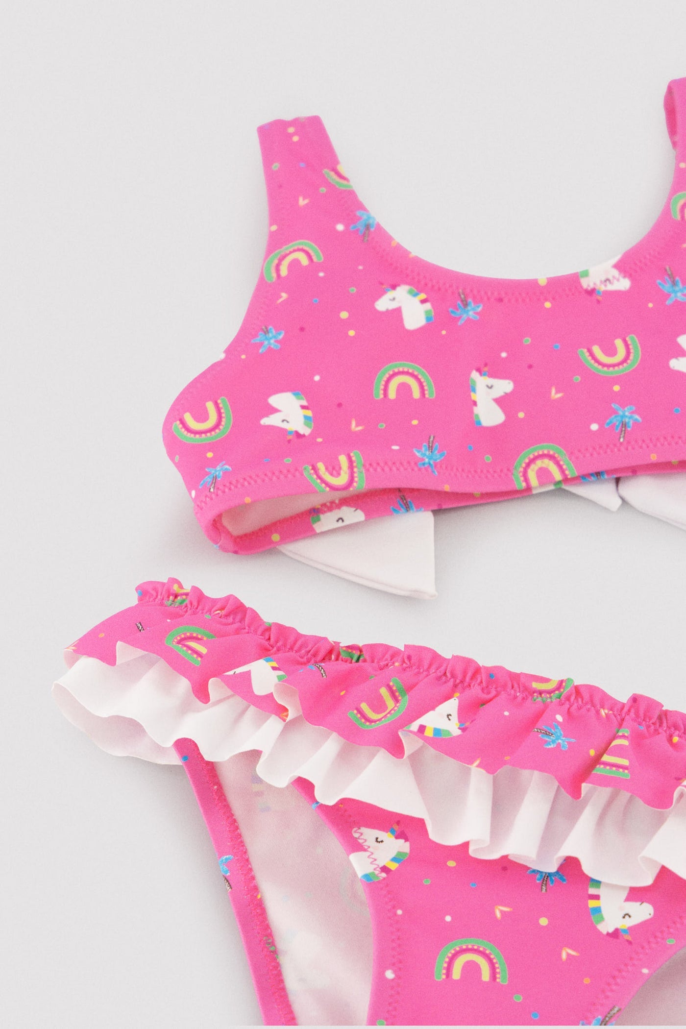 BIKINI BAMBINA ROSA CON STAMPA UNICORNI E ARCOBALENI YSABEL MORA